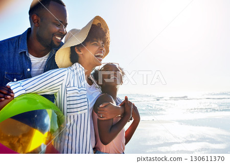 Black family, children or beach with a mother, father and daughter carrying a ball, walking on sand by the sea. Love, nature and ocean with a man, woman and girl child playing on the coast in summer 130611370