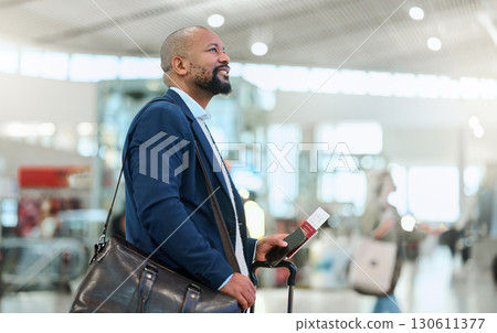 African businessman, airport terminal and walking, search or thinking for flight schedule time with passport. Corporate black man, global travel and focus on itinerary with personal luggage in London 130611377