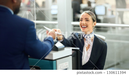 Airport, passport and travel with a woman passenger assistant helping a business man traveller with check in. Security, immigration or documents with a female working in a terminal for border control Airport, passport and travel with a woman passenger assistant helping a business man traveller with check in. Security, immigration or documents with a female working in a terminal for border control 130611394