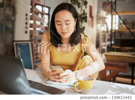 Asian woman, cafe and smartphone for connection, remote work and lady with online research, chatting and comfortable. Female, creative and freelancer in coffee shop, relax and texting for project Asian woman, cafe and smartphone for connection, remote work and lady with online research, chatting and comfortable. Female, creative and freelancer in coffee shop, relax and texting for project 130611442