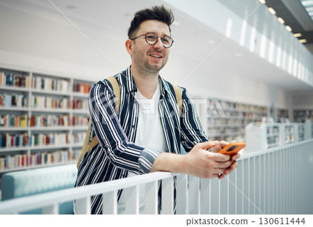 Library, smart student or intelligent man with phd research goals, vision for success and excited for knowledge learning. University, campus or college people thinking of books in education and study Library, smart student or intelligent man with phd research goals, vision for success and excited for knowledge learning. University, campus or college people thinking of books in education and study 130611444