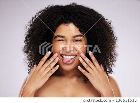 Black woman, tongue and afro in studio portrait with beauty, wellness and cosmetic skincare glow by background. Young gen z model, african and cosmetics with funny face, natural and healthy aesthetic 130611536