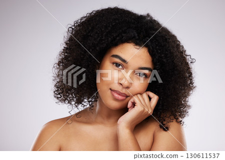 Black woman, beauty and face, skincare portrait and natural cosmetics, hair care and glow on studio background. Hand, skin and wellness with dermatology, cosmetic and makeup with African female 130611537