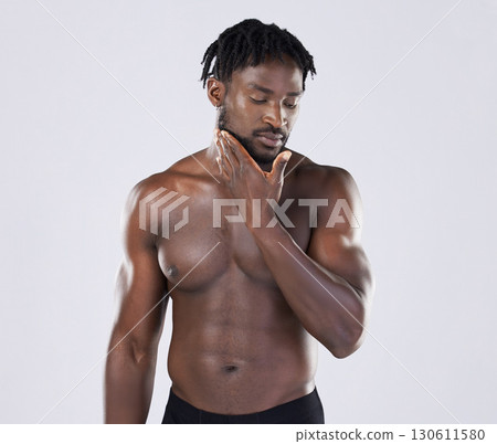 Black man, skincare and fitness portrait with body sports person in studio for strong muscle and power. Health and wellness of a sexy male bodybuilder with growth after exercise, workout and training 130611580