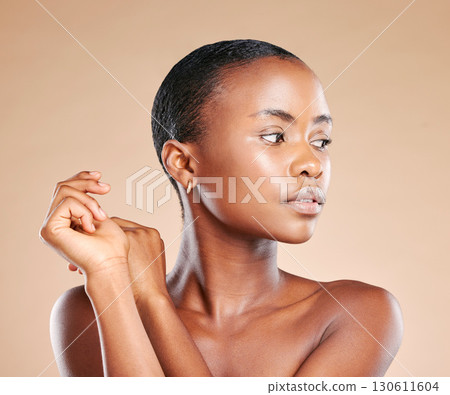 Beauty, wellness and face of black woman in studio to promote luxury treatment, cosmetics and makeup. Spa aesthetic, skincare and female model on brown background for facial, shine and glowing skin Beauty, wellness and face of black woman in studio to promote luxury treatment, cosmetics and makeup. Spa aesthetic, skincare and female model on brown background for facial, shine and glowing skin 130611604