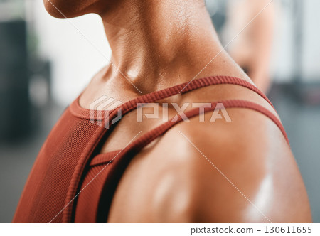 Shoulder, closeup and injury on woman at gym for fitness, training or workout while feeling discomfort. Arm pain, girl and zoom in on sports injury during health, exercise and cardio at sports center Shoulder, closeup and injury on woman at gym for fitness, training or workout while feeling discomfort. Arm pain, girl and zoom in on sports injury during health, exercise and cardio at sports center 130611655