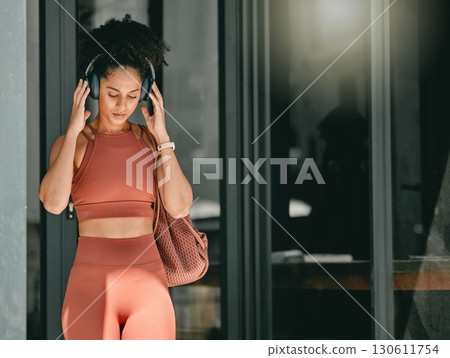 Fitness, walking and black woman listen to music, relax podcast or radio for calm, stress relief or wellness mockup. Headphones, leaving gym and mock up girl on travel after training workout exercise Fitness, walking and black woman listen to music, relax podcast or radio for calm, stress relief or wellness mockup. Headphones, leaving gym and mock up girl on travel after training workout exercise 130611754