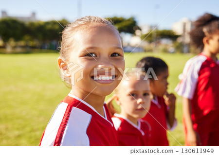 Girl soccer player, portrait and field for training, teamwork and group diversity with smile. Young female kids, football group and happy for team building, learning and development with excited face Girl soccer player, portrait and field for training, teamwork and group diversity with smile. Young female kids, football group and happy for team building, learning and development with excited face 130611949