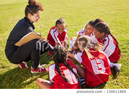 Huddle, sport or coach with children hands for soccer strategy training or team goals in Canada. Team building, circle or woman and group of girls on football field for game support, match or workout Huddle, sport or coach with children hands for soccer strategy training or team goals in Canada. Team building, circle or woman and group of girls on football field for game support, match or workout 130611960