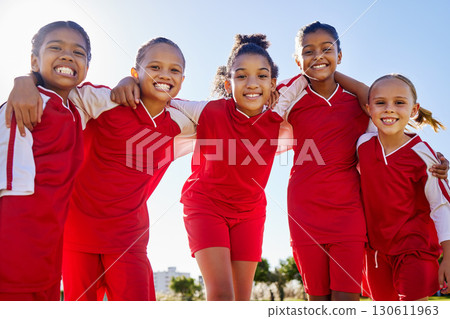 Football girl, group portrait and field for smile, team building happiness and solidarity at sport training. Female kids, sports diversity and friends with teamwork, learning or soccer with low angle 130611963