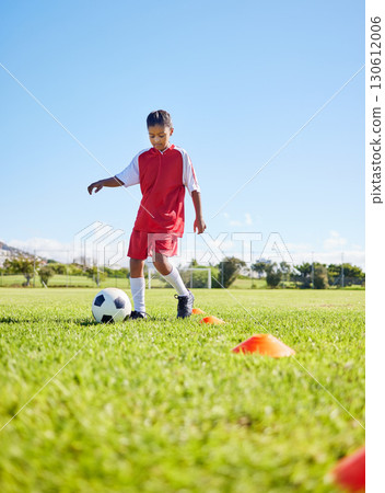 Football girl kid, grass and training for fitness, sports or balance with talent development, control or speed. Female child, fast football dribbling and exercise feet on field with strong mindset Football girl kid, grass and training for fitness, sports or balance with talent development, control or speed. Female child, fast football dribbling and exercise feet on field with strong mindset 130612006