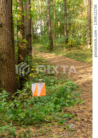 Orienteering. Control point Prism and electric composter for orienteering in the autumn forest. 130612256