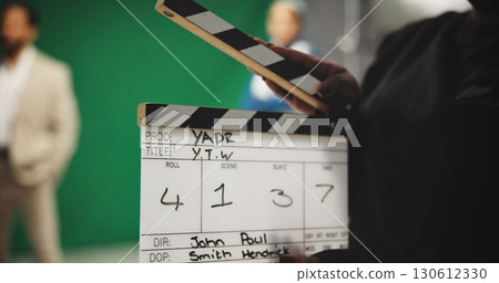 Person, hands and production studio with clapperboard for action, take or behind the scenes in set. Closeup, director or producer with movie slate, green screen or reel for film cut, number or roll 130612330
