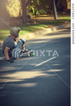 Skateboard, street and mockup with a sports man skating or training outdoor while moving at speed for action. Fitness, exercise and road with a male skater or athlete outside to practice his balance 130612439