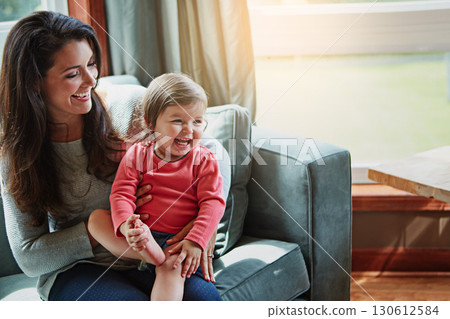 Relax, happy and smile with mother and baby on sofa for bonding, quality time and child development. Growth, support and trust with mom and daughter in family home for health, connection and care Relax, happy and smile with mother and baby on sofa for bonding, quality time and child development. Growth, support and trust with mom and daughter in family home for health, connection and care 130612584