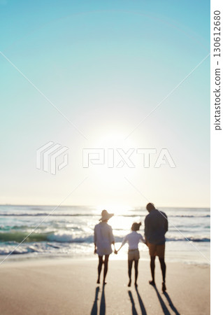 Family, beach and sunset walk during summer on vacation or holiday relaxing at a peaceful scenery at the ocean. Mockup, blurred and parents with daughter, child or kid with childhood freedom at sea 130612680