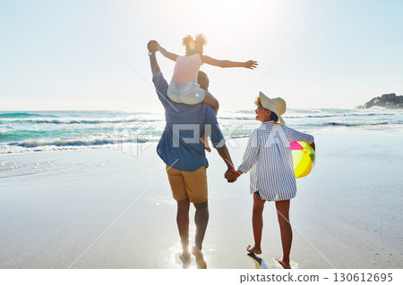 Walking black family, beach and back of people holding hands, parents and child enjoy fun outdoor quality time together. Ocean sea water, freedom peace and youth kid, father and mother in Jamaica Walking black family, beach and back of people holding hands, parents and child enjoy fun outdoor quality time together. Ocean sea water, freedom peace and youth kid, father and mother in Jamaica 130612695