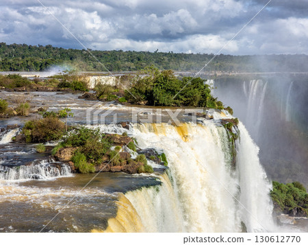 Powerful Iguazu Falls, one of the world's most impressive waterfalls. Brazil side. Brazilian wilderness landscape. 130612770