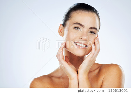 Skincare, beauty and portrait of a woman in a studio with a cosmetic, makeup and natural face routine. Health, wellness and female model with an organic healthy facial treatment by a gray background. 130613091