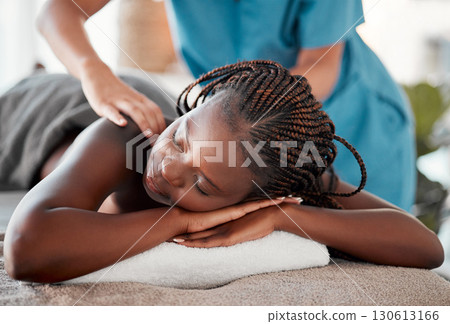 Black woman, bed and relax in spa for back massage, deep tissue or relaxation in stress relief at resort. Happy African American female relaxing with hands of masseuse massaging for physical therapy 130613166