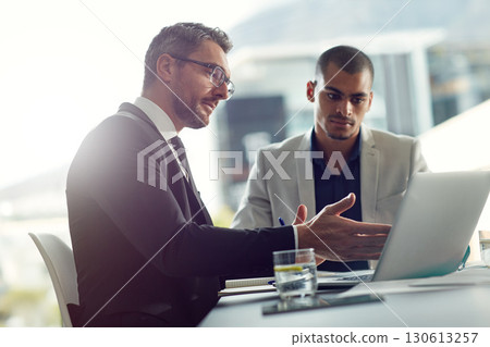 Business people, laptop and talking about planning online for corporate strategy or partnership. Men together in a meeting discussion while speaking about internet report, email or communication 130613257