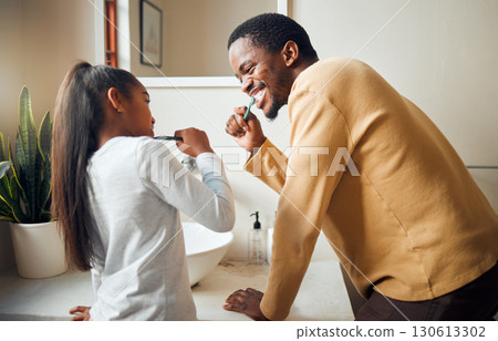 Oral care, brushing teeth and father with daughter in bathroom for hygiene, grooming and bonding. Dental health, girl and black people cleaning while having fun, playful and smile in their home 130613302