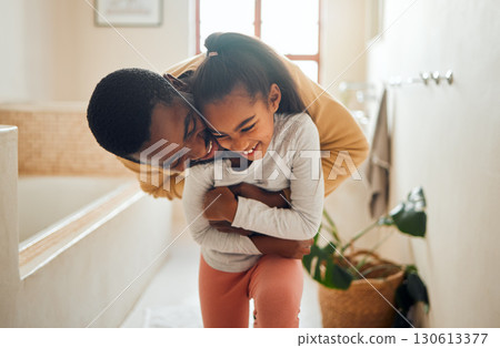 Black family, father and child for a hug in happy home with love, care and support in bathroom. Man and girl kid together for happiness with smile, energy and embrace for safety, health and wellness 130613377