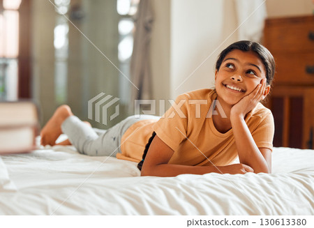 Fantasy, bed and black girl thinking, ideas and relax on weekend, happiness and summer break. African American female child, young lady or daydreaming, imagination and thought with wonder and bedroom 130613380