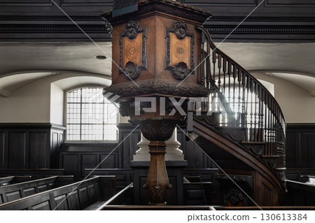 Ornately carved wooden pulpit with an attached staircase, which is located in St Martin-in-the-Fields. Ornately carved wooden pulpit with an attached staircase, which is located in St Martin-in-the-Fields. 130613384