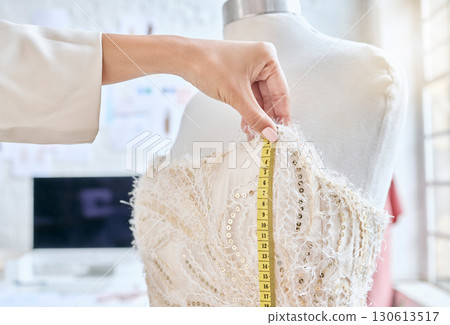Design, hands and woman designer with measuring tape for dress, pattern and details with fabric in studio. Fashion designer, hand and measurement, creative and luxury, classic and elegant clothing Design, hands and woman designer with measuring tape for dress, pattern and details with fabric in studio. Fashion designer, hand and measurement, creative and luxury, classic and elegant clothing 130613517