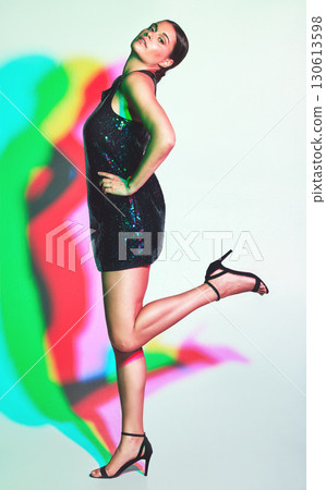 Fashion, woman portrait and neon shadow for a kaleidoscope party with color on a studio background. Beauty, art and aesthetic model confident about creative style for magazine mockup or copyspace 130613598