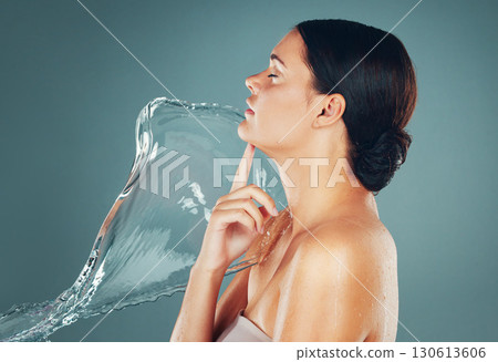 Skin, skincare and water splash on woman body for hygiene and hydration isolated in a studio background. Grooming, shower and female dermatology for young beautiful adult doing self care 130613606