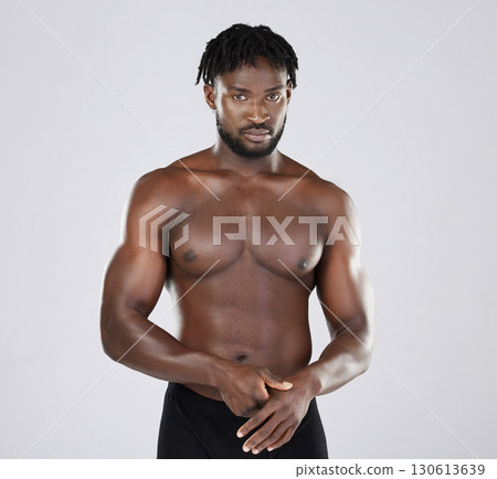 Fitness, black man and body portrait of sports person in studio for strong muscle and power. Health and wellness of a sexy male bodybuilder model with growth after exercise, workout and training Fitness, black man and body portrait of sports person in studio for strong muscle and power. Health and wellness of a sexy male bodybuilder model with growth after exercise, workout and training 130613639