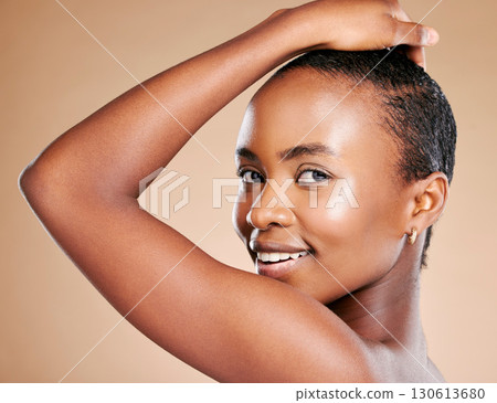 Beauty, skincare and portrait of black woman in studio to promote luxury treatment, cosmetics and makeup. Spa aesthetic, wellness and girl model on brown background for facial, shine and glowing skin 130613680