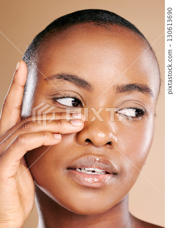 Aesthetic, beauty and face of black woman with hands to promote luxury treatment, cosmetics and makeup. Spa wellness, skincare and female model on brown background for facial, shine and glowing skin 130613690