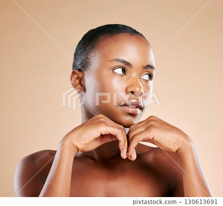 Beauty, wellness and face of black woman with hands to promote luxury treatment, cosmetics and makeup. Spa aesthetic, skincare and female model on brown background for facial, shine and glowing skin 130613691
