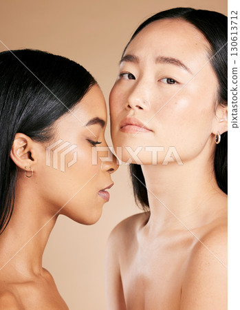 Makeup, beauty and diversity of women faces with skincare glow on skin and cosmetic self care. Facial, dermatology and spa treatment for friends or models isolated against a brown studio background Makeup, beauty and diversity of women faces with skincare glow on skin and cosmetic self care. Facial, dermatology and spa treatment for friends or models isolated against a brown studio background 130613712