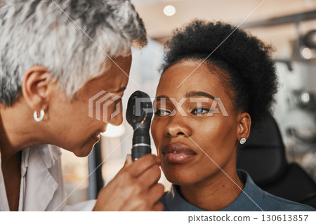Laser, senior doctor or black woman in eye exam for eyesight at optometrist office. Mature optician helping an African customer or client testing or checking vision, iris or retina visual health 130613857