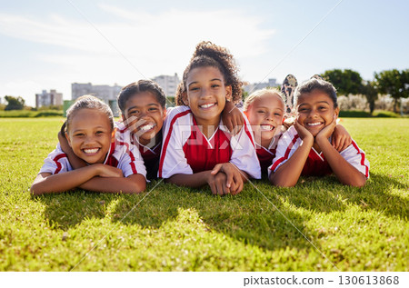 Soccer children team, portrait or happy for success, goal or wellness in match, game or competition with smile on field floor. Motivation, sport or kids in training, workout for teamwork exercise Soccer children team, portrait or happy for success, goal or wellness in match, game or competition with smile on field floor. Motivation, sport or kids in training, workout for teamwork exercise 130613868