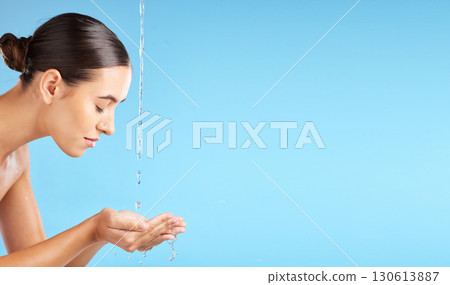 Beauty, water and mockup with a model woman cleaning her face in studio on a blue background for hygiene. Skincare, hands and mock up with an attractive young female washing her skin for hydration Beauty, water and mockup with a model woman cleaning her face in studio on a blue background for hygiene. Skincare, hands and mock up with an attractive young female washing her skin for hydration 130613887