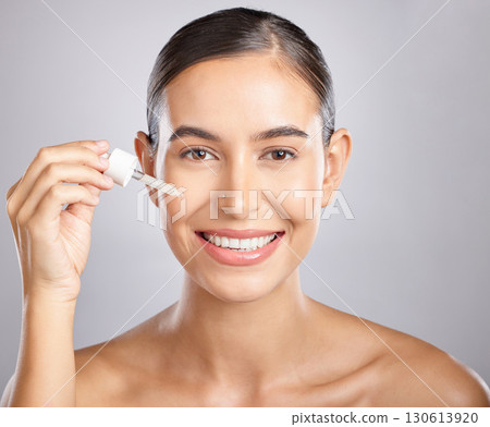 Beauty portrait, skincare or woman with serum for glowing skin hydration, anti aging or luxury facial protection. Happy aesthetic face of girl with liquid spa product, collagen oil or hyaluronic acid 130613920