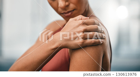 Closeup, fitness and black woman with shoulder pain, muscle ache and strain after training, workout and inflammation. African American lady, female and athlete with sports accident, torn and bruised 130613976