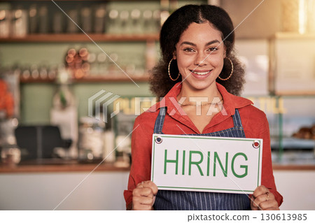 Portrait, small business or black woman with hiring sign for onboarding in a cafe or coffee shop with hospitality. Restaurant manager with a happy smile with recruitment message after opening store 130613985