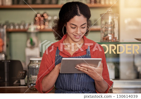 Small business, cafe barista and woman with tablet to manage orders, inventory and stock check. Coffee shop waiter, technology and happy young female waitress with touchscreen for managing sales. 130614039