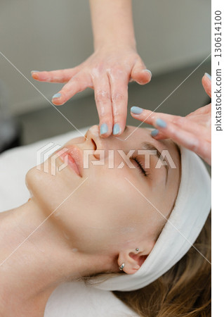 Relaxing Facial Massage at a Spa Treatment Session Relaxing Facial Massage at a Spa Treatment Session 130614100