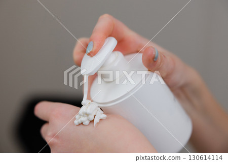 Applying Moisturizing Cream from a Pump Bottle 130614114