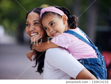 Mom, girl child and happy with piggyback ride in urban park, street and outdoor for love, bonding and care. Family, mother and daughter with smile, riding back or happiness on vacation, relax or walk 130614218