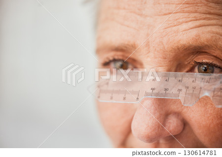 Ophthalmology, ruler and measuring with eyes of old woman for healthcare, medical and vision. Medicine, optometry and consulting with patient and test for lens, problem and optician in clinic 130614781