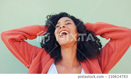 Woman, hands and play with hair for beauty or wellness with smile at green wall, energy or cosmetic. Black female, happiness and care for curly treatment for healthy results for laughing with freedom Woman, hands and play with hair for beauty or wellness with smile at green wall, energy or cosmetic. Black female, happiness and care for curly treatment for healthy results for laughing with freedom 130614783