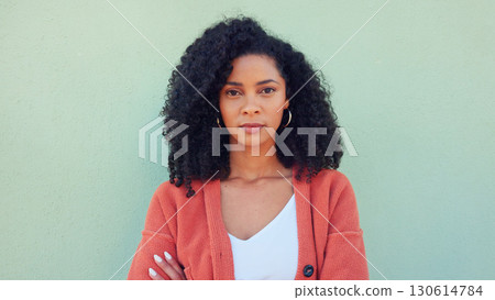 City, green wall and woman portrait on travel holiday in urban town with vacation and freedom. Arms crossed, confidence and traveling with a female person from Jamaica with modern fashion and style City, green wall and woman portrait on travel holiday in urban town with vacation and freedom. Arms crossed, confidence and traveling with a female person from Jamaica with modern fashion and style 130614784